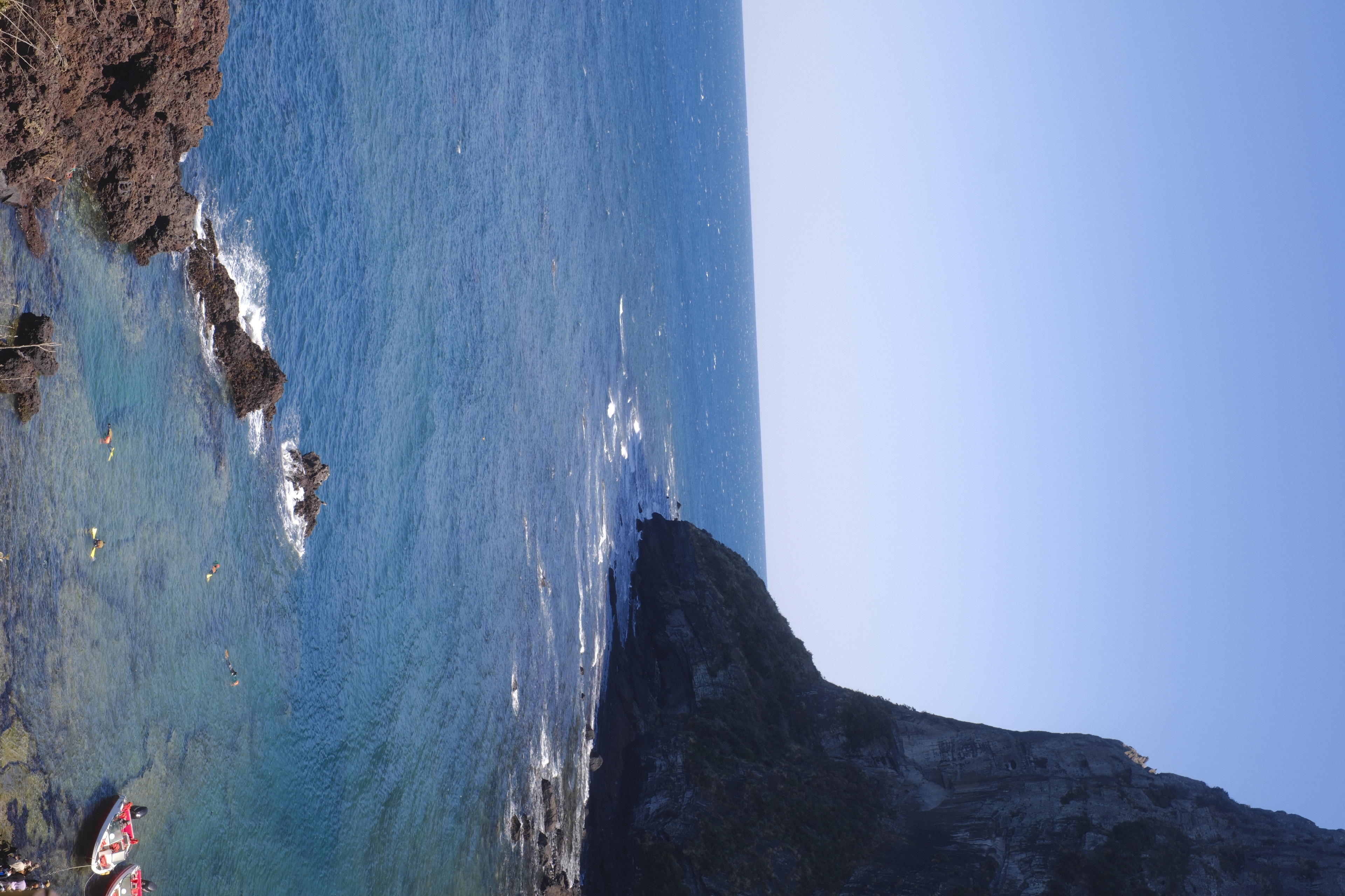 Blue coastal cliff and sea